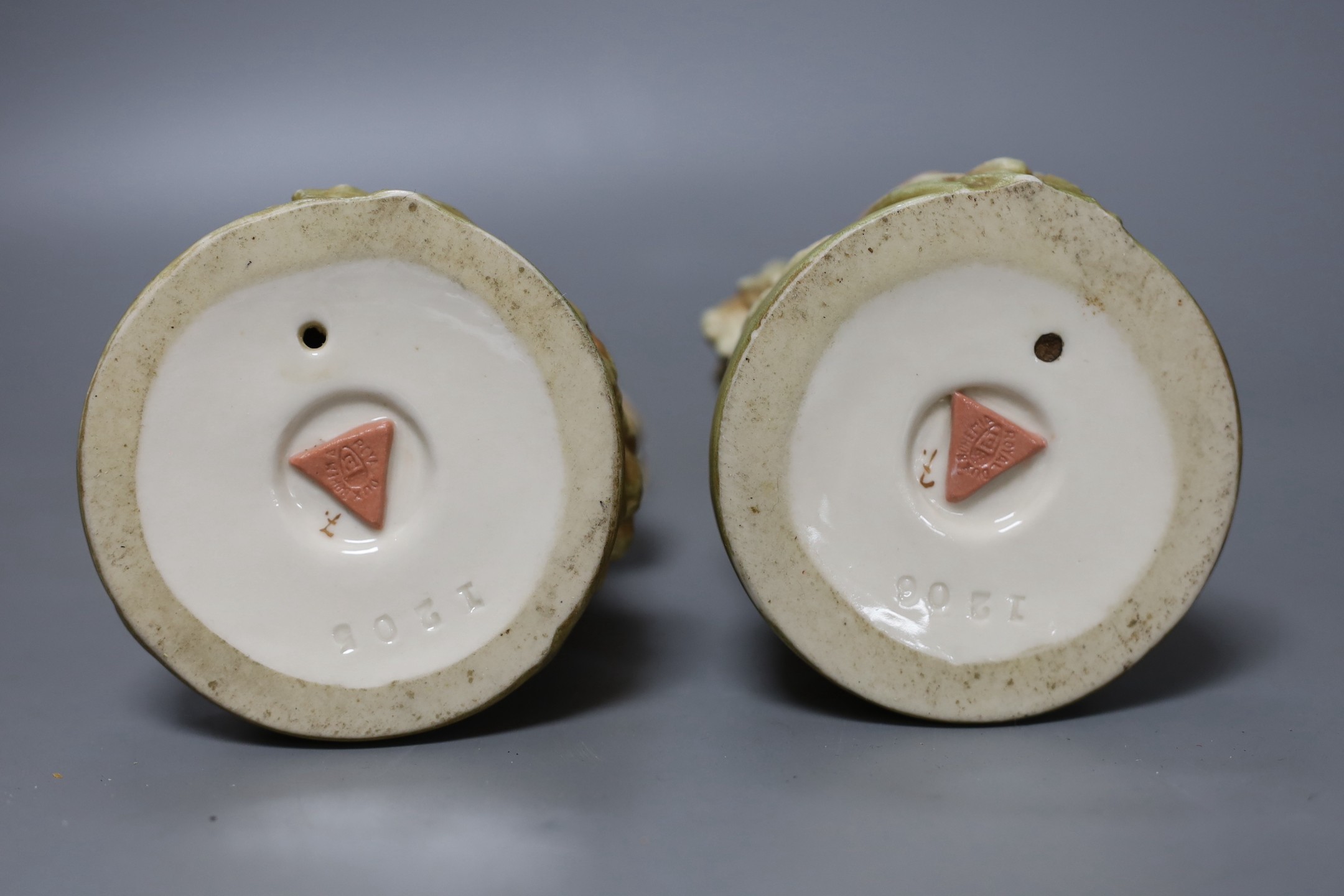 A pair of Royal Dux figures and a pair of Royal Dux donkey groups, 24cm